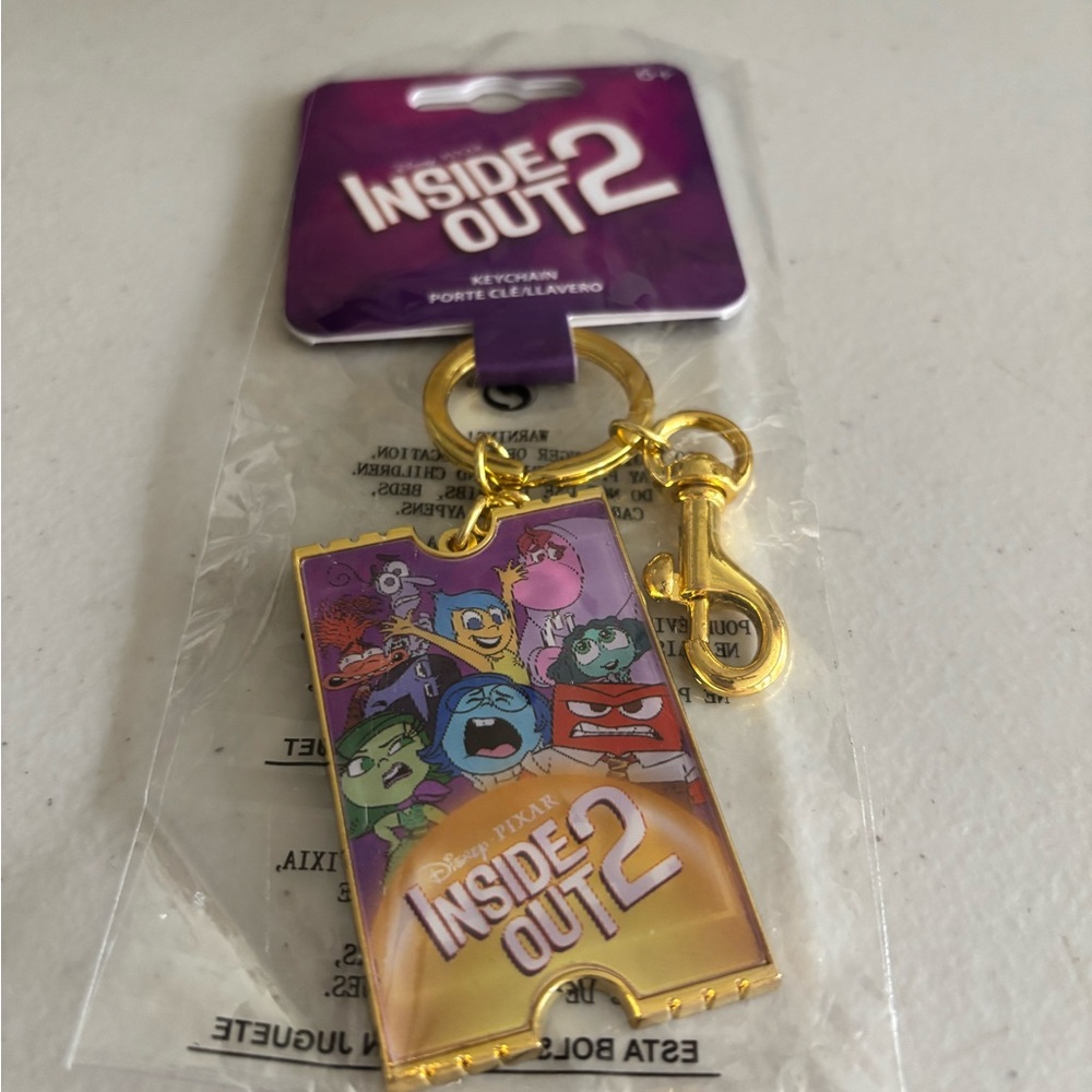 Inside Out 2 Keychain with Gold Clip. Pixar  some weight to it. Woman -men